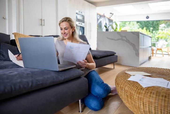 Woman working at home and looking very happy