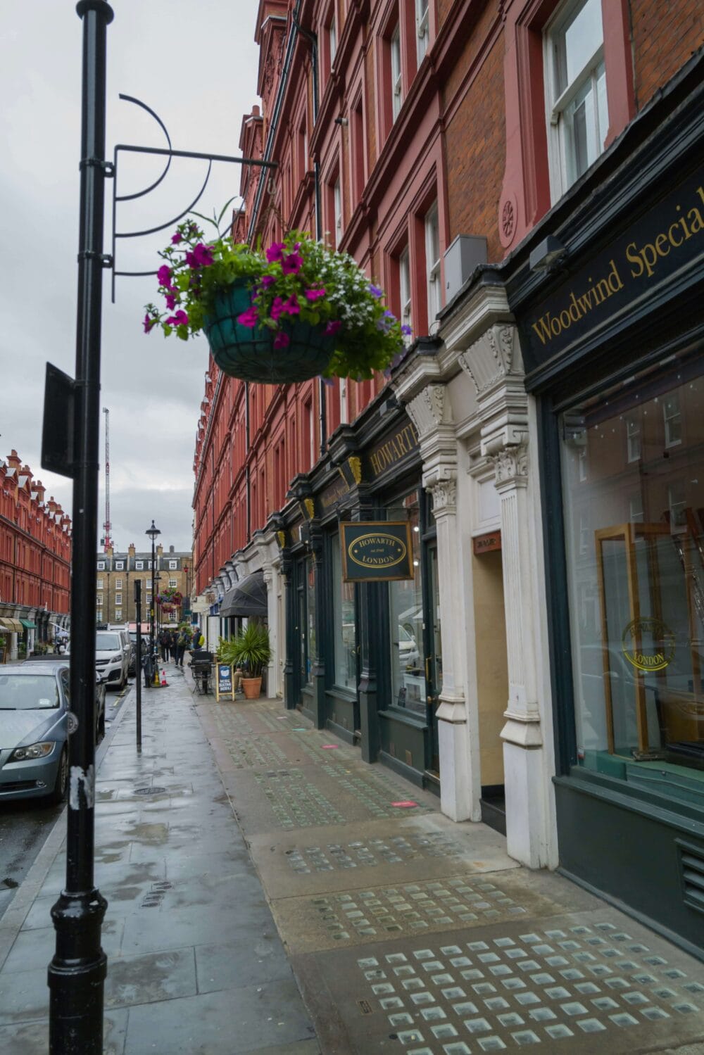 Traditional London mews street with brick houses and cobblestone road