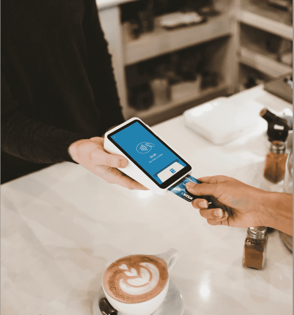 Paying with a bank card using contactless payment in a London café