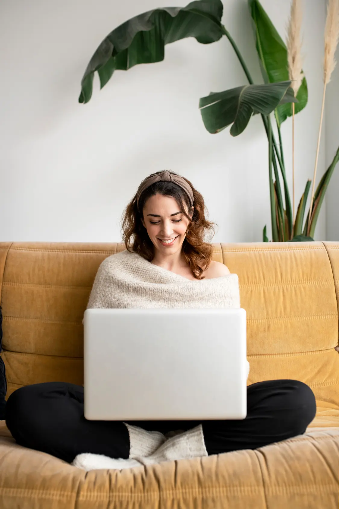 Girl in sofa looking for London apartment.