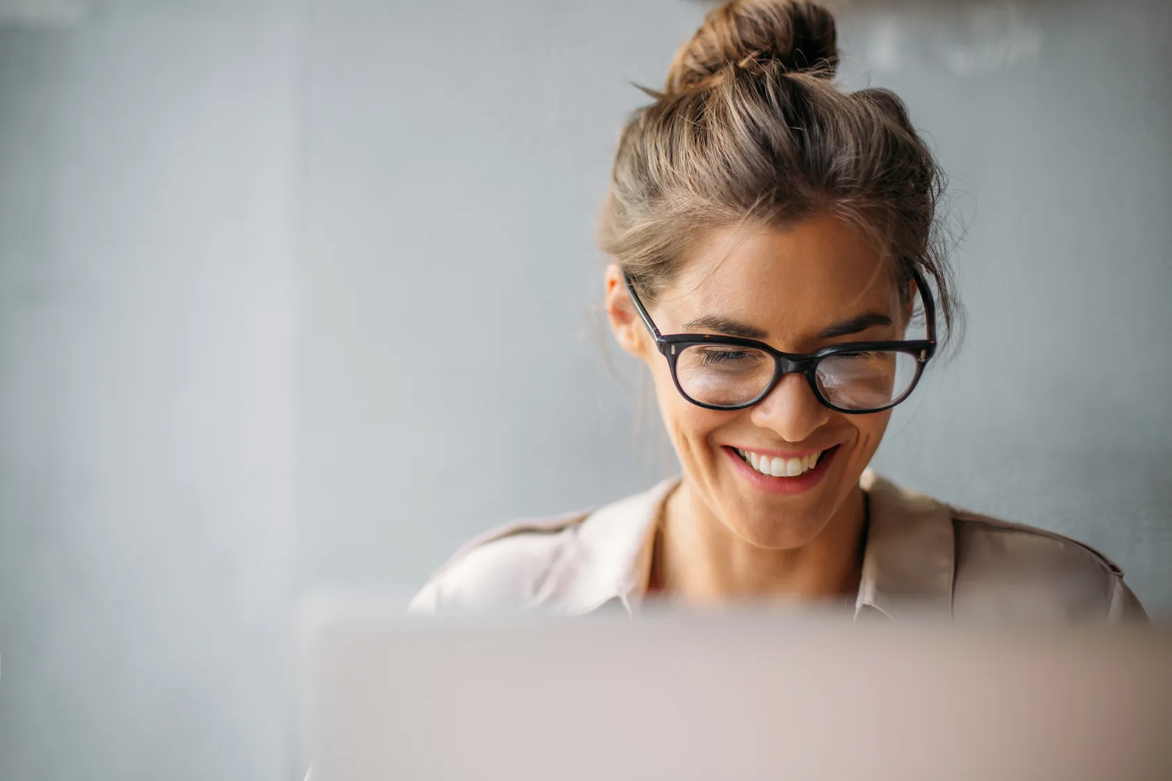 Professional woman looking at computer screen.