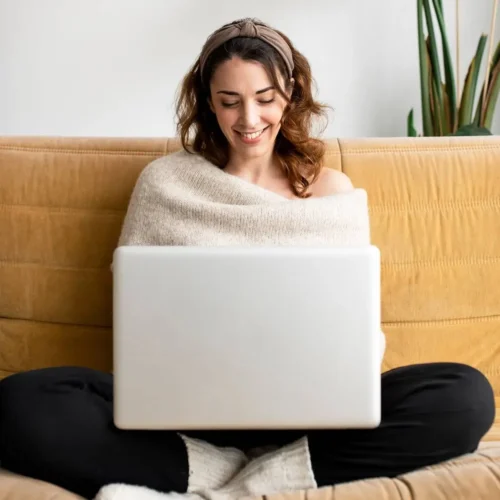 Girl in sofa looking for remote homes in London.